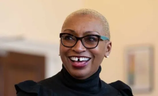 A woman looks up smiling