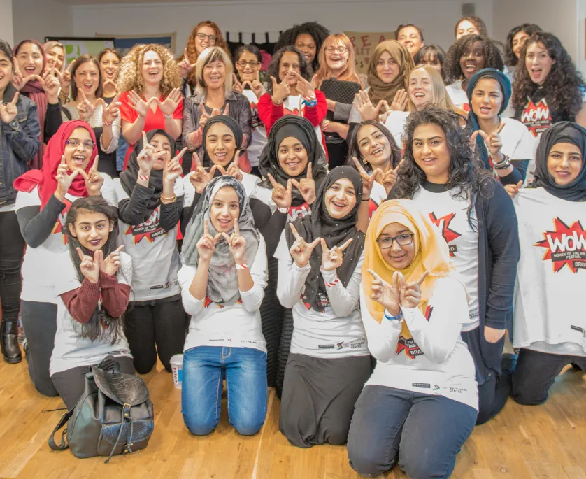 A group of women in WOW branded t-shirts