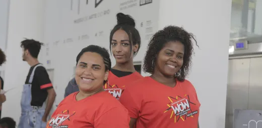 Three women in WOW Rio t-shirts
