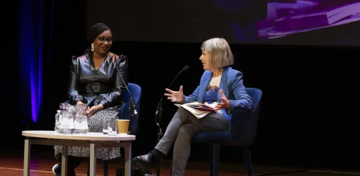Two women on stage talking